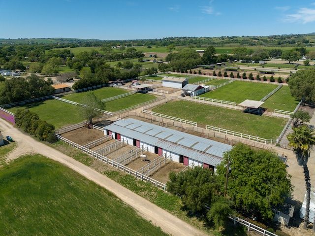 birds eye view of property with a rural view