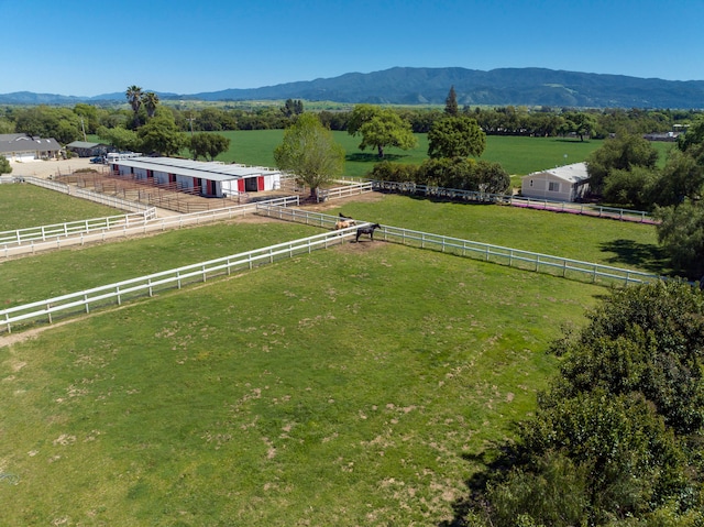 drone / aerial view featuring a mountain view and a rural view