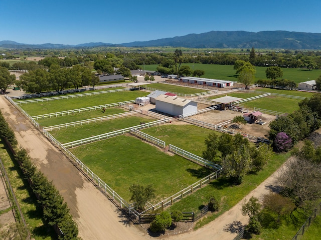 aerial view with a mountain view and a rural view