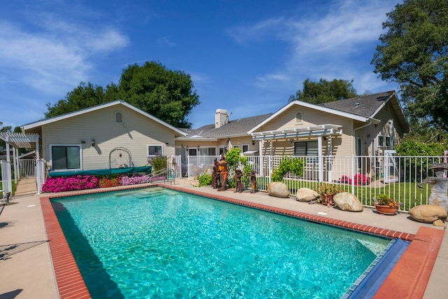 view of swimming pool with a pergola