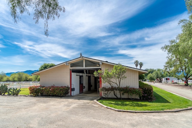 exterior space with a front yard and a carport