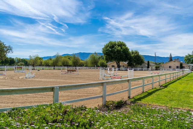 surrounding community with a rural view and a mountain view