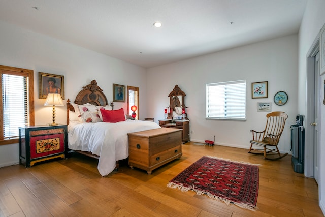 bedroom with wood-type flooring