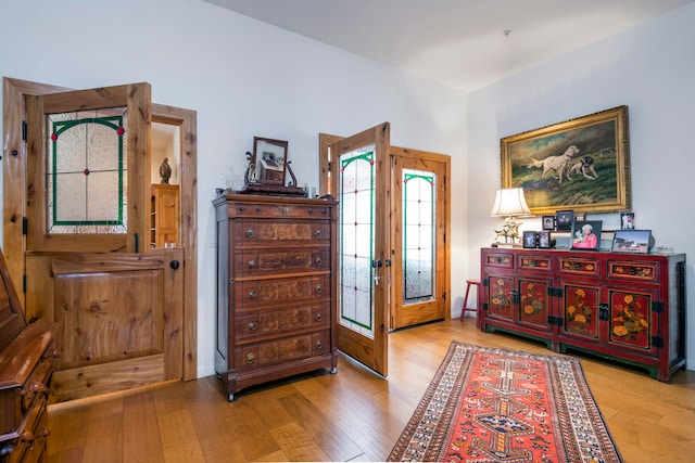 entrance foyer featuring hardwood / wood-style flooring and french doors