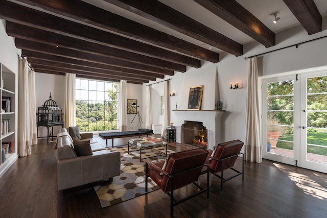 living room with a wealth of natural light, beam ceiling, and dark hardwood / wood-style floors