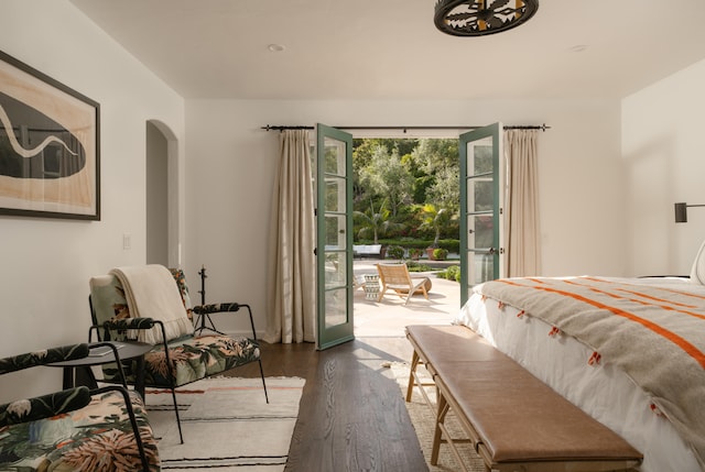 bedroom featuring hardwood / wood-style flooring and access to exterior