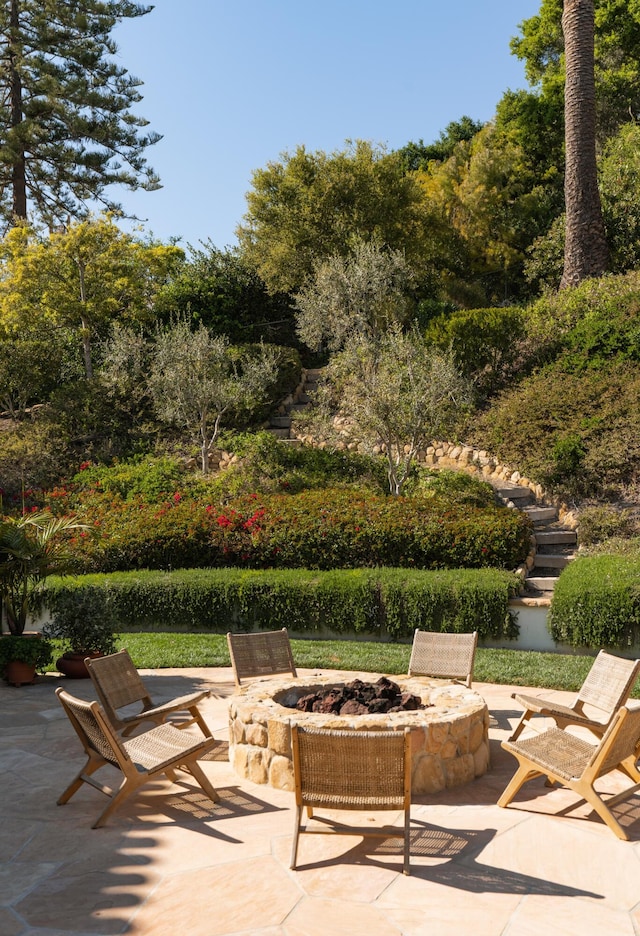 view of terrace featuring an outdoor fire pit