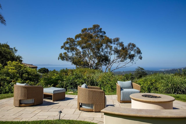 view of patio / terrace with a fire pit