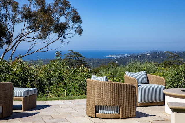 view of patio / terrace with a view of trees