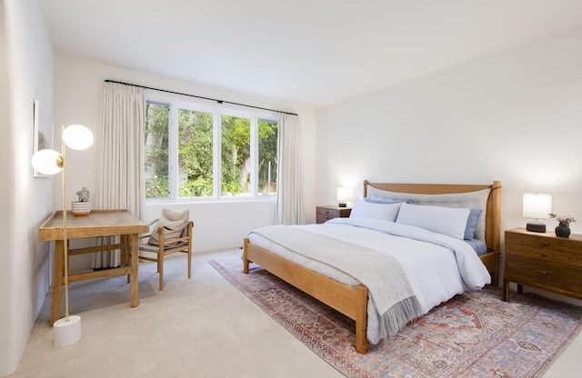 bedroom with light colored carpet