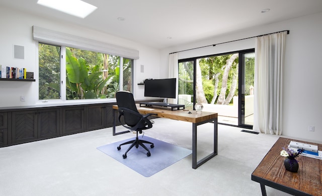 office with visible vents and light colored carpet