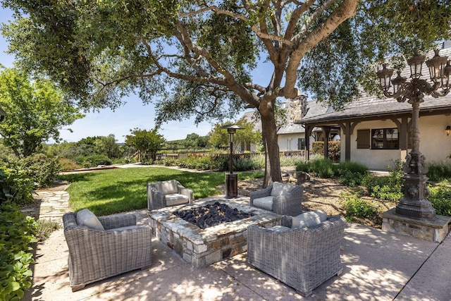 view of patio / terrace with a fire pit