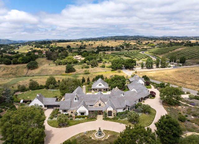 birds eye view of property with a rural view