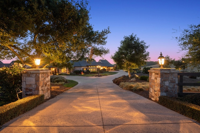 view of gate at dusk