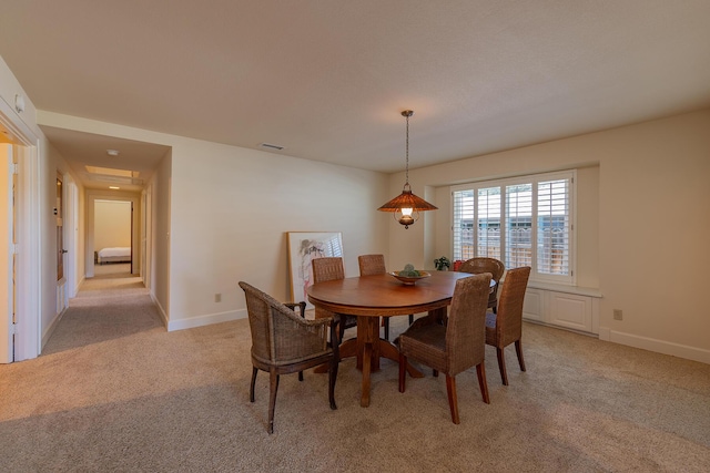 view of carpeted dining space