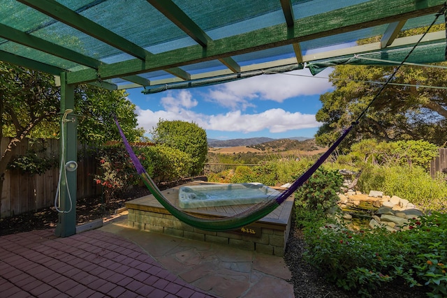 view of patio / terrace featuring a pergola and a mountain view