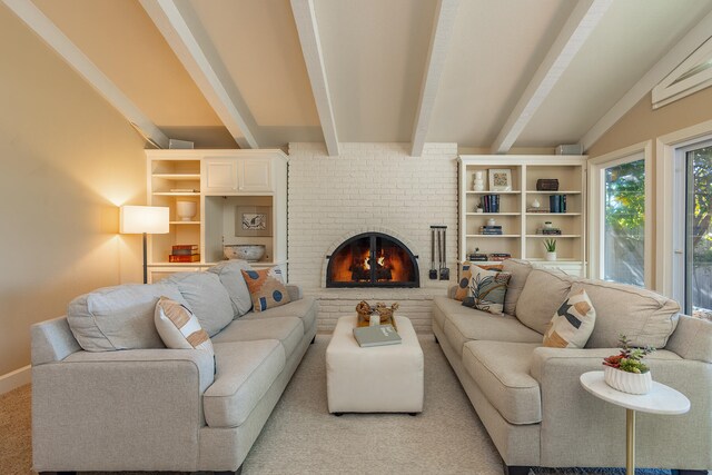 living room featuring beamed ceiling and a brick fireplace