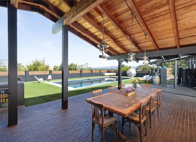 view of patio featuring a fenced in pool