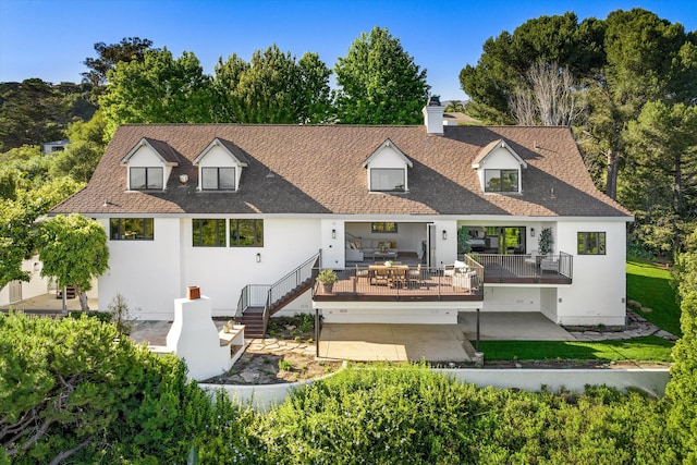 back of property featuring outdoor lounge area and a patio