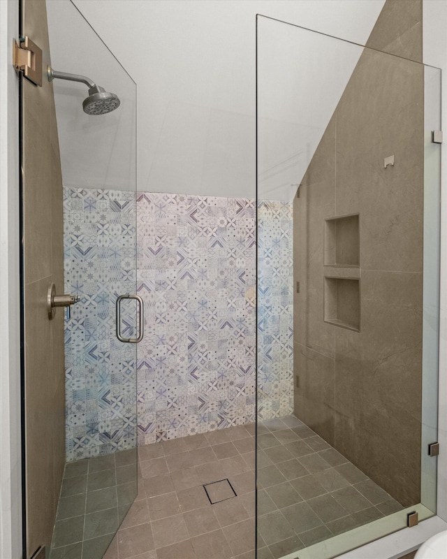 bathroom with a shower with shower door