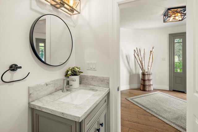 bathroom featuring vanity and hardwood / wood-style floors