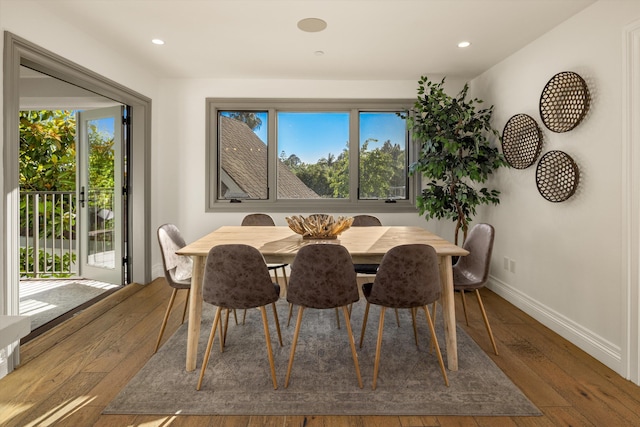 dining area with dark hardwood / wood-style flooring