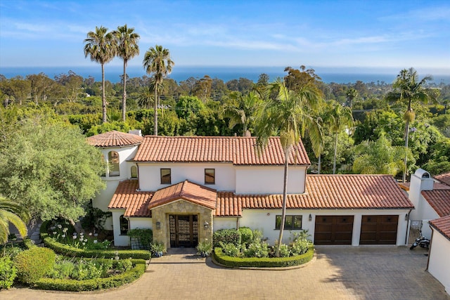 mediterranean / spanish house with a garage