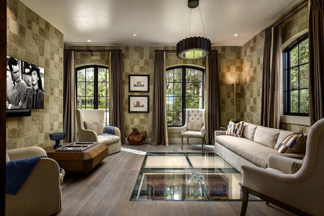 sitting room featuring a wealth of natural light, recessed lighting, and wood finished floors