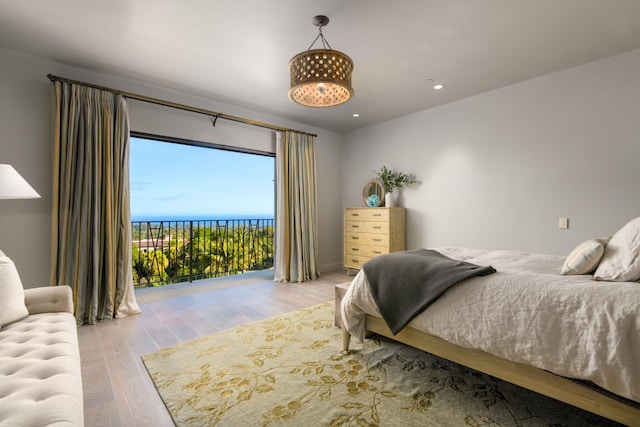 bedroom featuring recessed lighting and light wood-style flooring