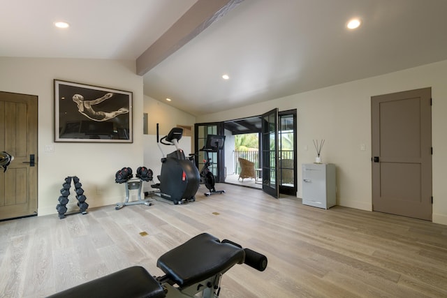 workout area with vaulted ceiling, light wood finished floors, and recessed lighting