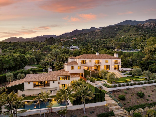 aerial view at dusk with a mountain view