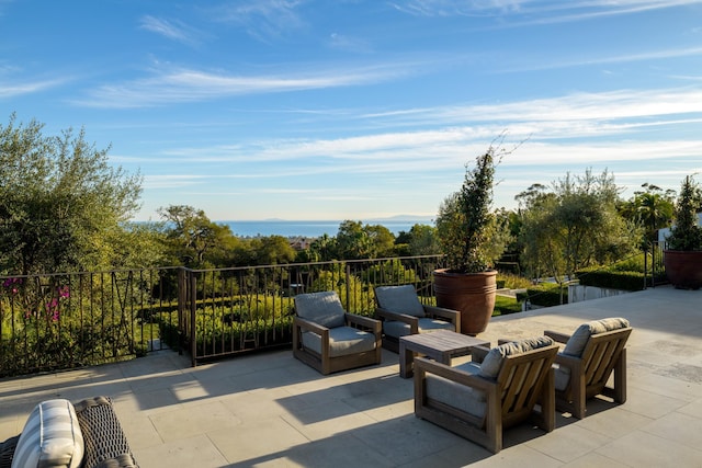 view of patio / terrace with a water view and outdoor lounge area