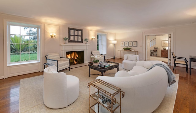 living room featuring crown molding and hardwood / wood-style flooring