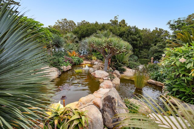 exterior space with a small pond