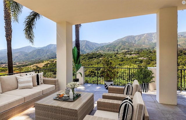 view of patio with a mountain view and an outdoor hangout area