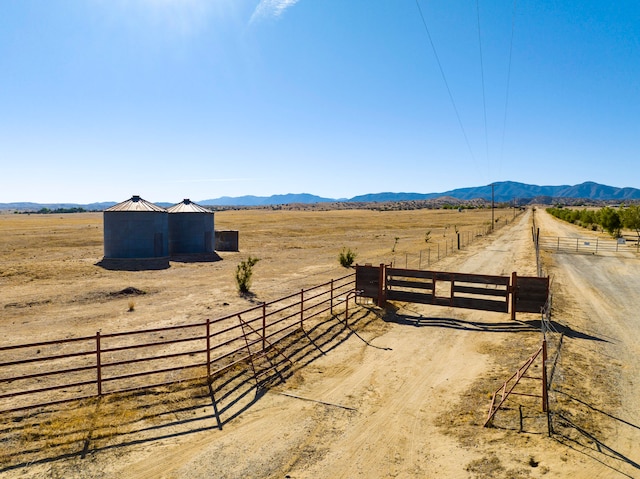 view of yard featuring a mountain view and a rural view