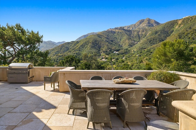 view of patio / terrace featuring a mountain view