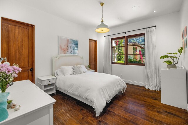 bedroom featuring dark hardwood / wood-style flooring