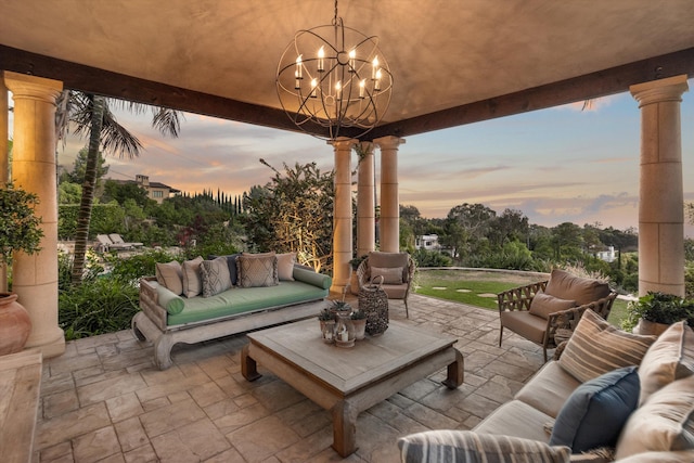 patio terrace at dusk featuring outdoor lounge area