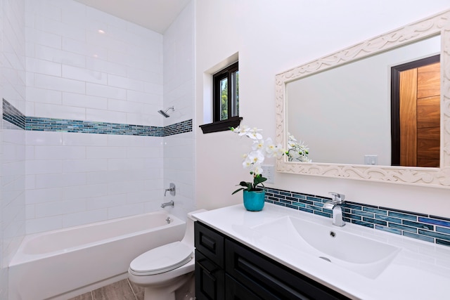 full bathroom with tasteful backsplash, vanity, bathtub / shower combination, and toilet