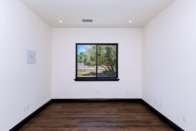 unfurnished room featuring dark hardwood / wood-style flooring