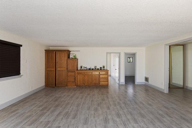 interior space featuring a textured ceiling