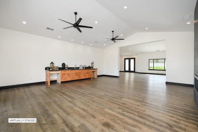 living room with dark hardwood / wood-style flooring, vaulted ceiling, and ceiling fan