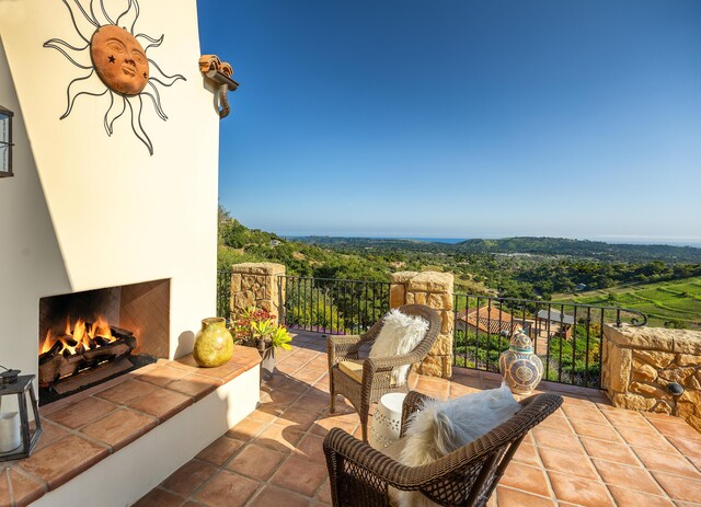 view of patio featuring a tile fireplace