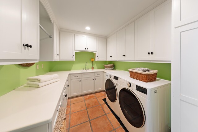 clothes washing area with cabinets, separate washer and dryer, ornamental molding, sink, and light tile floors