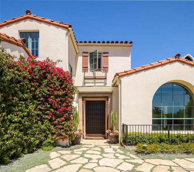 doorway to property with a balcony