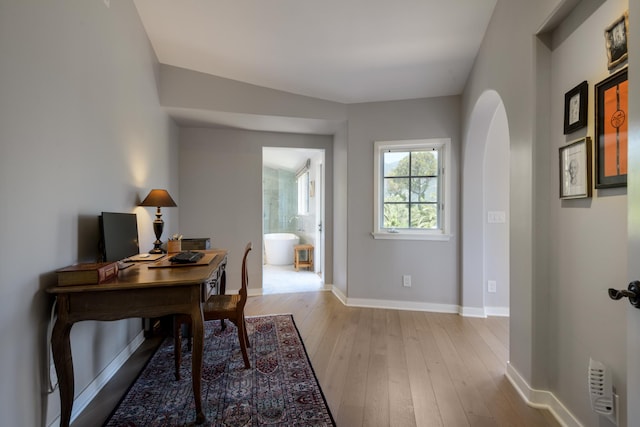 home office with light wood-type flooring