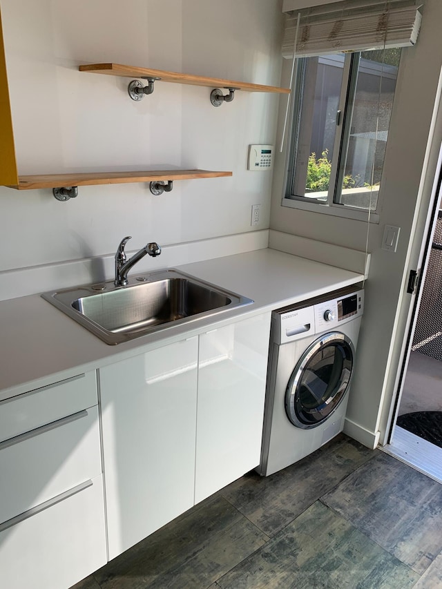 washroom featuring washer / clothes dryer and sink