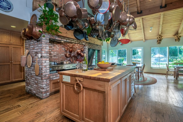 kitchen with a center island, wooden ceiling, light hardwood / wood-style flooring, and wood counters