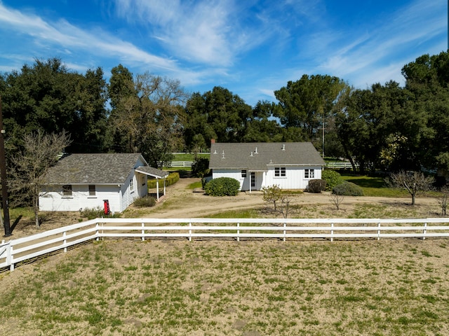 exterior space featuring a yard and a rural view